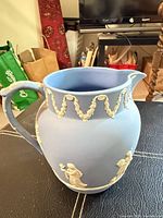 Full view of Wedgwood light blue Jasperware pitcher front