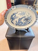 Front view of blue & white porcelain platter showing full Yuan pattern and shape