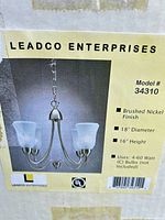 Box label showing brand, model 34310, brushed nickel finish, dimensions, bulb information