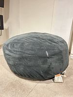 Full view of grey faux fur bean bag chair
