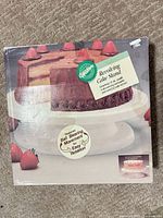 Front of boxed Wilton Revolving Cake Stand