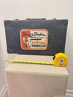 Front view of Black & Decker metal tool case with tape measure for scale