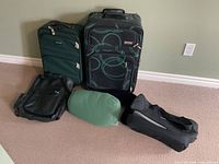 all luggage pieces and pillows grouped for overview
