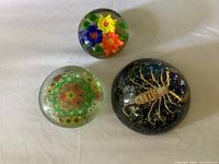 Group view of all three paperweights