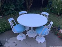 Full patio set: round table with four swivel chairs