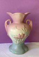 Front view showing floral relief, handles and color gradient