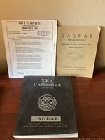 Front covers of price list, XK 140 handbook, and XK’s Unlimited catalog displayed side-by-side