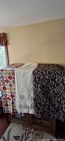 Three shower curtains draped side by side showing overall designs