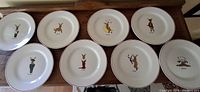 Eight plates laid out showing full set and condition