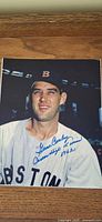 Front view of signed Gene Conley photo showing autograph and inscription