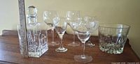 Full lot showing decanter, stemware, ice bucket