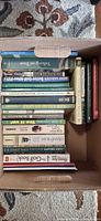Top view of box showing spines of numerous golf books