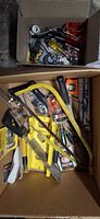 Overview of two boxes with assorted tools and hardware