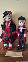 Front view of both dolls standing upright