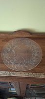 Full view of round clear glass platter on table