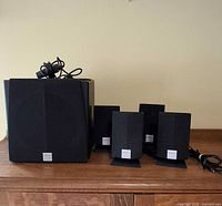 front view showing subwoofer and four satellites