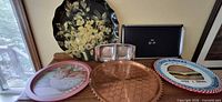 Full lot showing six serving trays on wooden surface