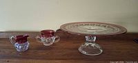 Full set showing cake stand, sugar, creamer