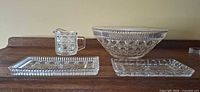 Group view of all four pressed glass pieces