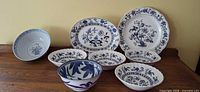Group photo of all eight blue and white dishes