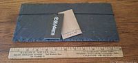 top view slate cheese board with ruler for scale and JK Adams tag