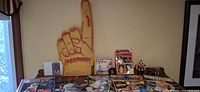 Overview of magazines, foam finger, CD, sealed packs and loose figure