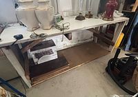 Full view of wooden workbench with lower shelf