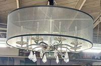 Overall view showing chrome frame, 8 sockets, drum shade, crystal drops