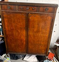 Full front view showing drawers, doors, overall form