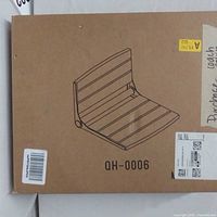 Sealed carton showing illustration of the portable floor gaming chair