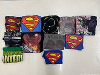 All 11 folded shirts arranged in two rows