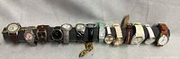 Full view of all 14 watches lined on display bar