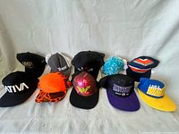 Ten hats including SATIVA, HIGH, Trex, Wonder Woman, Amsterdam, etc.