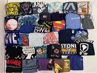 Full 30-shirt grid laid flat, showing colours and graphics