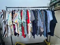 Full rack showing all 39 shirts of varied patterns and colors