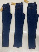 Front view of all three pairs laid flat showing color, cut and attached tags