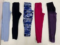 Five pairs folded: light blue, black, blue-white print, fuchsia, purple ombré