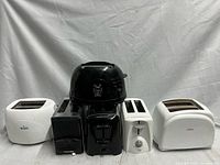 Front view of five of the toasters lined up