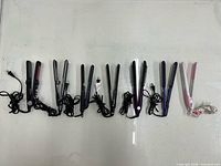Group shot of all seven flat irons laid side by side