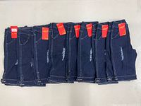 All eight pairs folded showing fronts with tags
