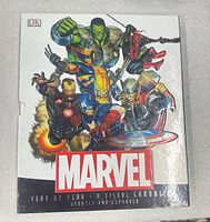 Front of slipcase showing title and Marvel characters