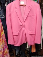 Front view showing color, lapel, pockets, single button