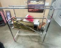 Full view of chrome retail double rack showing two top bars, base frame and diagonal support
