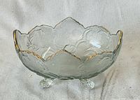 Full view of Jeannette Lombardi glass bowl showing gold-trimmed scalloped rim and feet