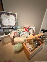 Group shot of all bath gift sets, sponges, wooden crate and candle holders