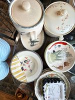 Group view of casseroles, bowls, plates showing patterns and condition