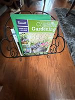 Rack holding Sunset Container Gardening book