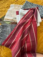 Group of five mixed textile items laid out