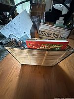 Cookbooks inside wicker/rattan holder