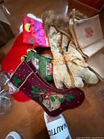 Pile of six embellished stockings showing colors, materials and styles